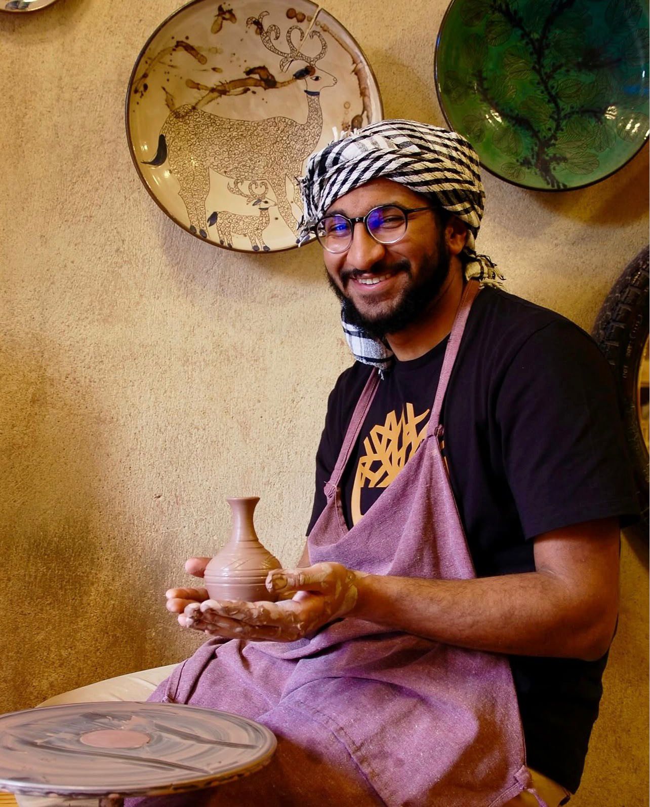 Ali Hussein at the potter's wheel